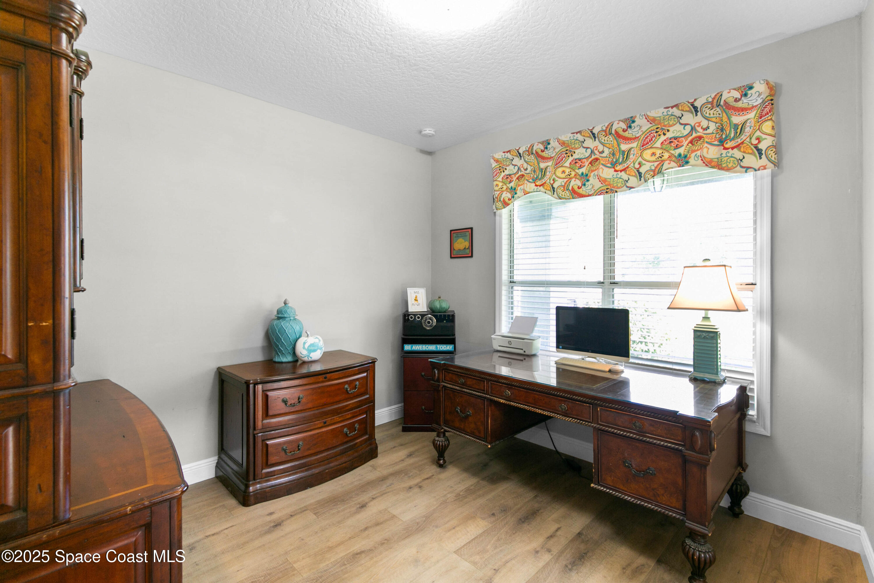 3530 Big Pine Road Melbourne, FL 32934 - Photo 8 of 39 a living room with furniture and a flat screen tv