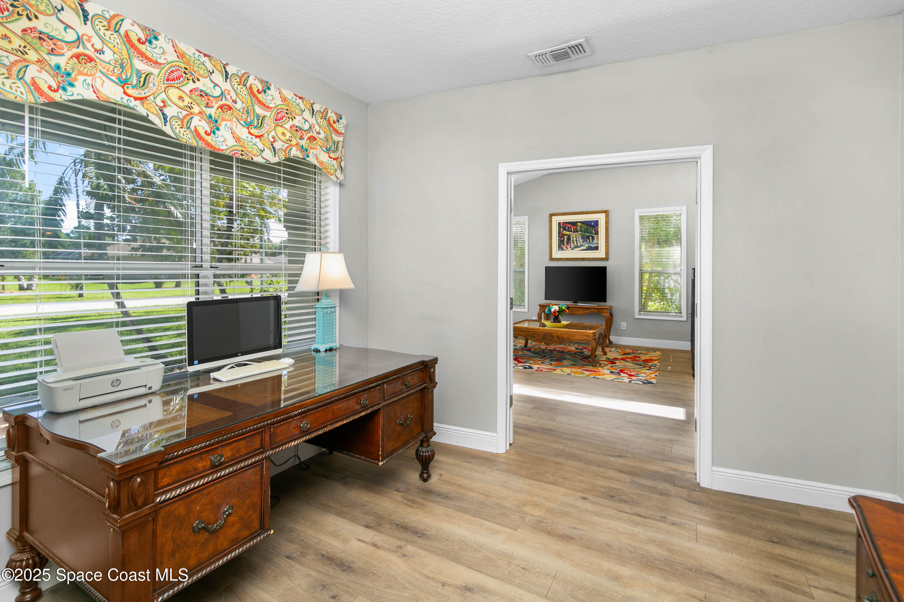 3530 Big Pine Road Melbourne, FL 32934 - Photo 9 of 39 a view of a workspace with furniture and a window