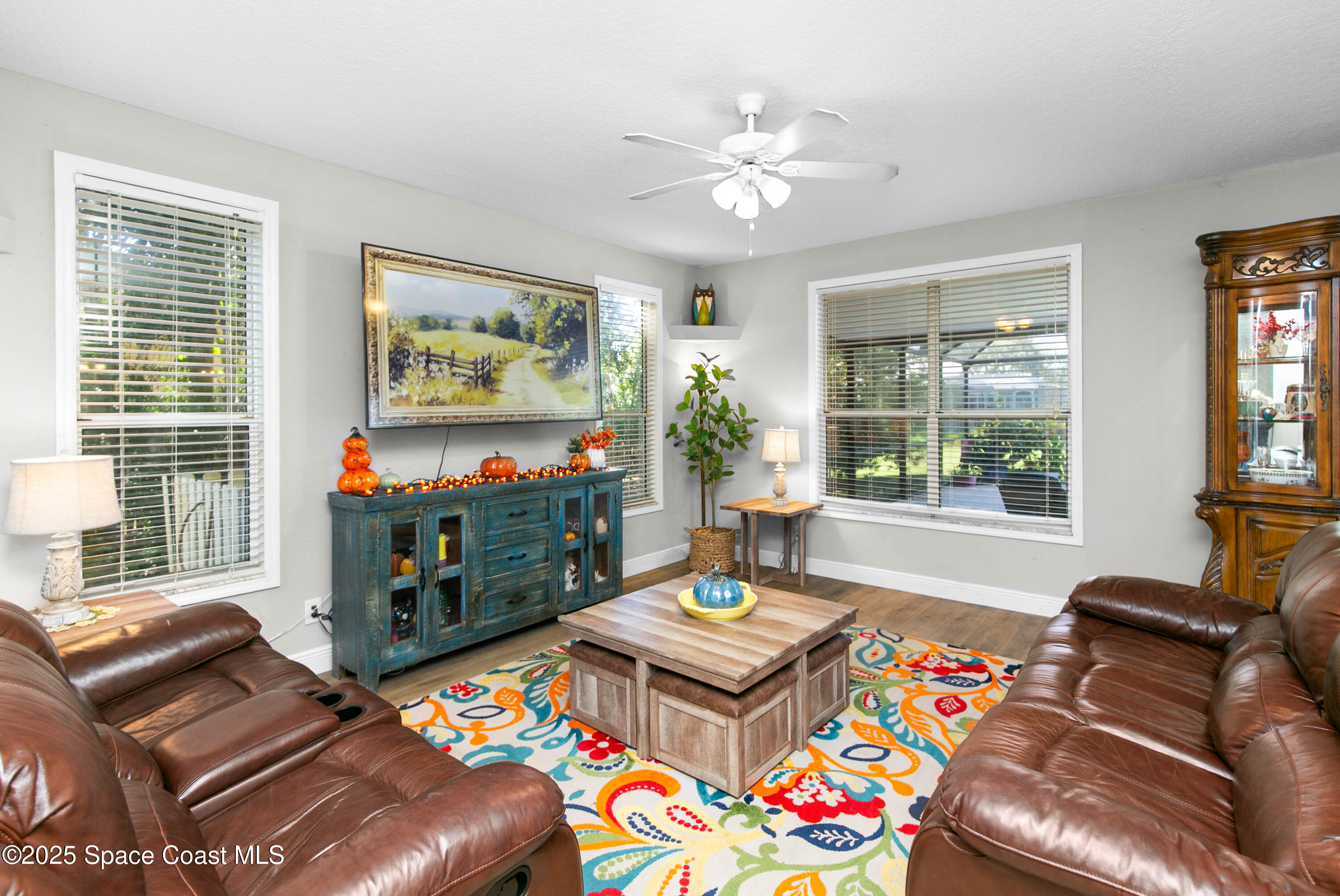 3530 Big Pine Road Melbourne, FL 32934 - Photo 10 of 39 a living room with furniture and a flat screen tv