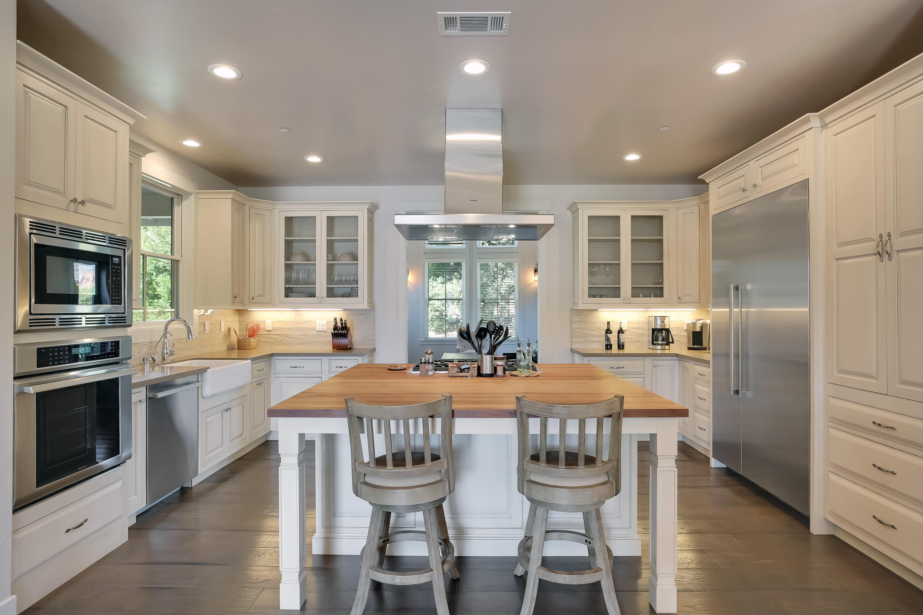 1030 Cambridge Drive Santa Barbara, CA 93111 - Photo 12 of 35 a kitchen with granite countertop a center island stainless steel appliances cabinets and a counter top space