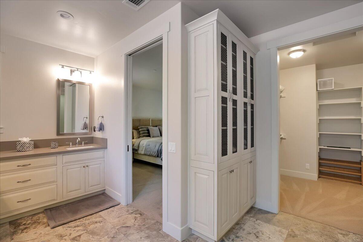 1030 Cambridge Drive Santa Barbara, CA 93111 - Photo 21 of 35 a bathroom with a double vanity sink a mirror and a shower