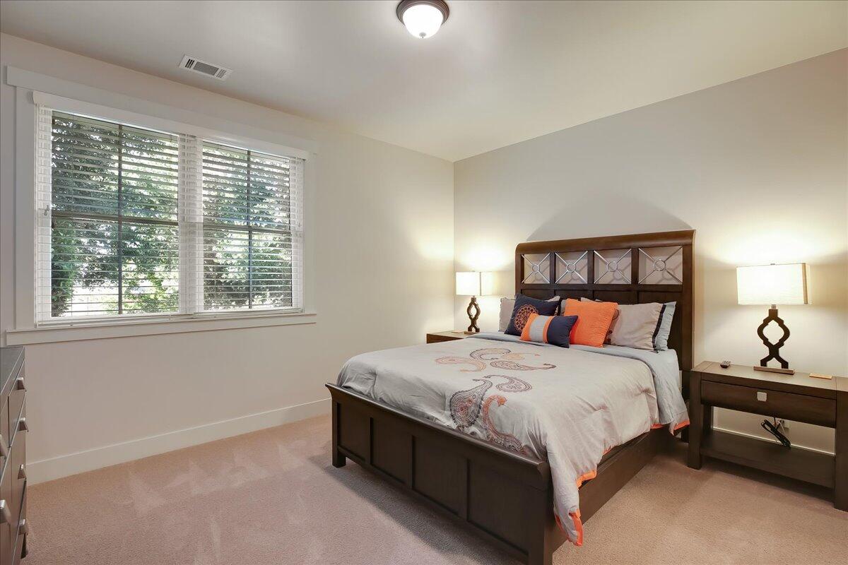 1030 Cambridge Drive Santa Barbara, CA 93111 - Photo 25 of 35 a large bed sitting in a bedroom next to a window