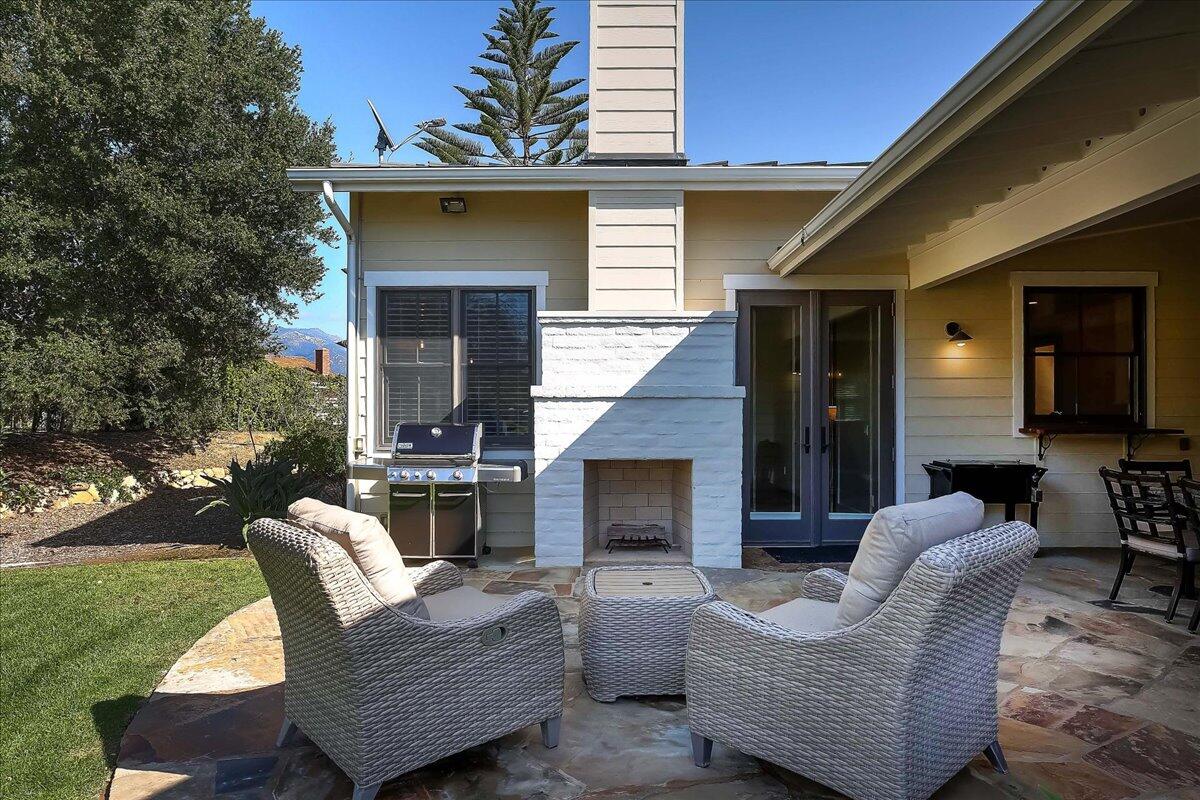 1030 Cambridge Drive Santa Barbara, CA 93111 - Photo 35 of 35 a view of a patio with couches chairs and a fireplace