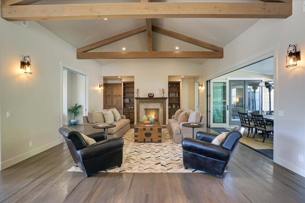 1030 Cambridge Drive Santa Barbara, CA 93111 - Photo 4 of 35 a living room with fireplace furniture and a wooden floor