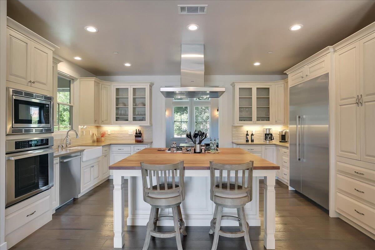 1030 Cambridge Drive Santa Barbara, CA 93111 - Photo 10 of 35 a kitchen with granite countertop a center island stainless steel appliances cabinets and a counter top space