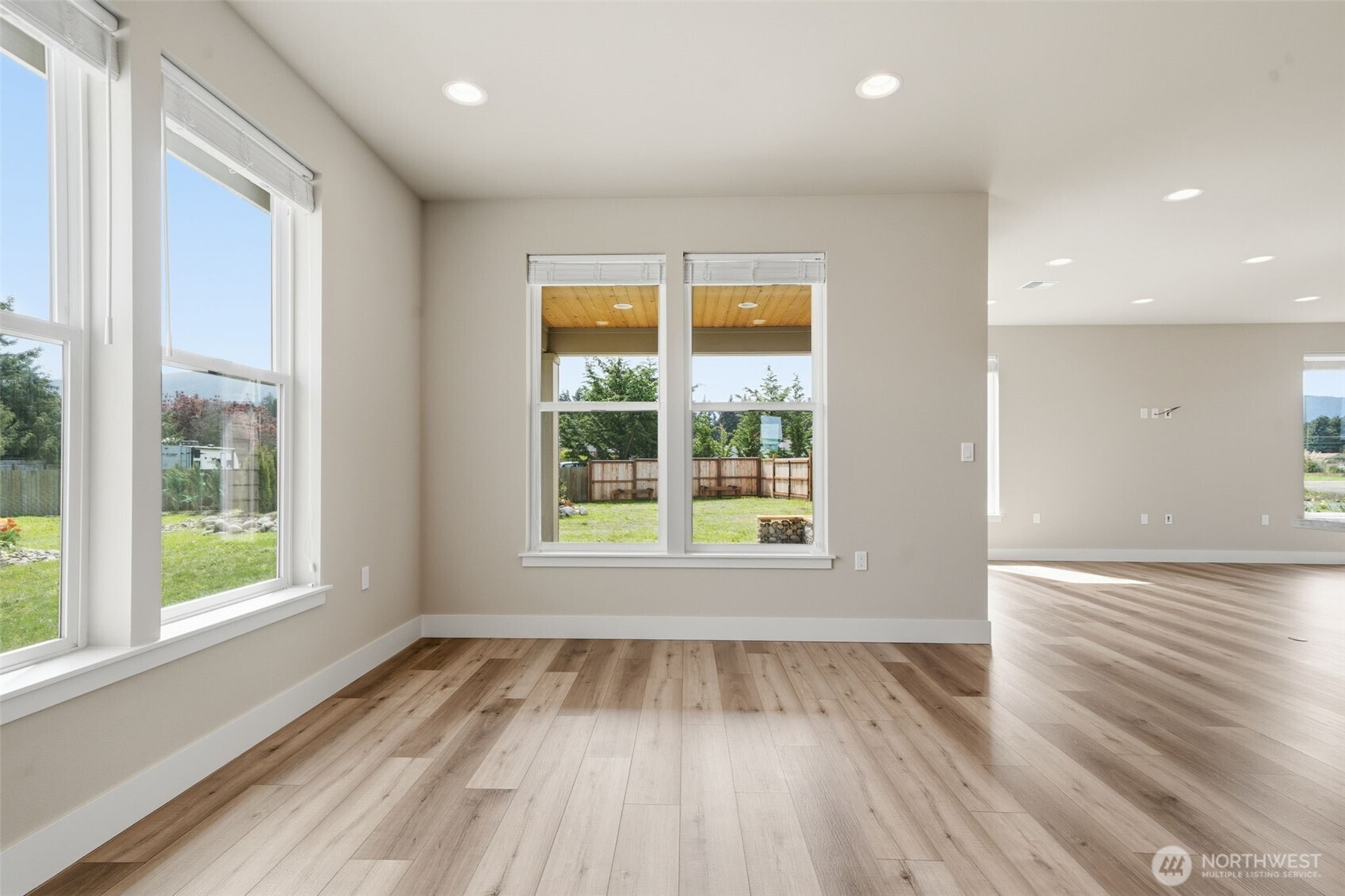 35 Viking Way Sequim, WA 98382 - Photo 11 of 39 an empty room with wooden floor and windows