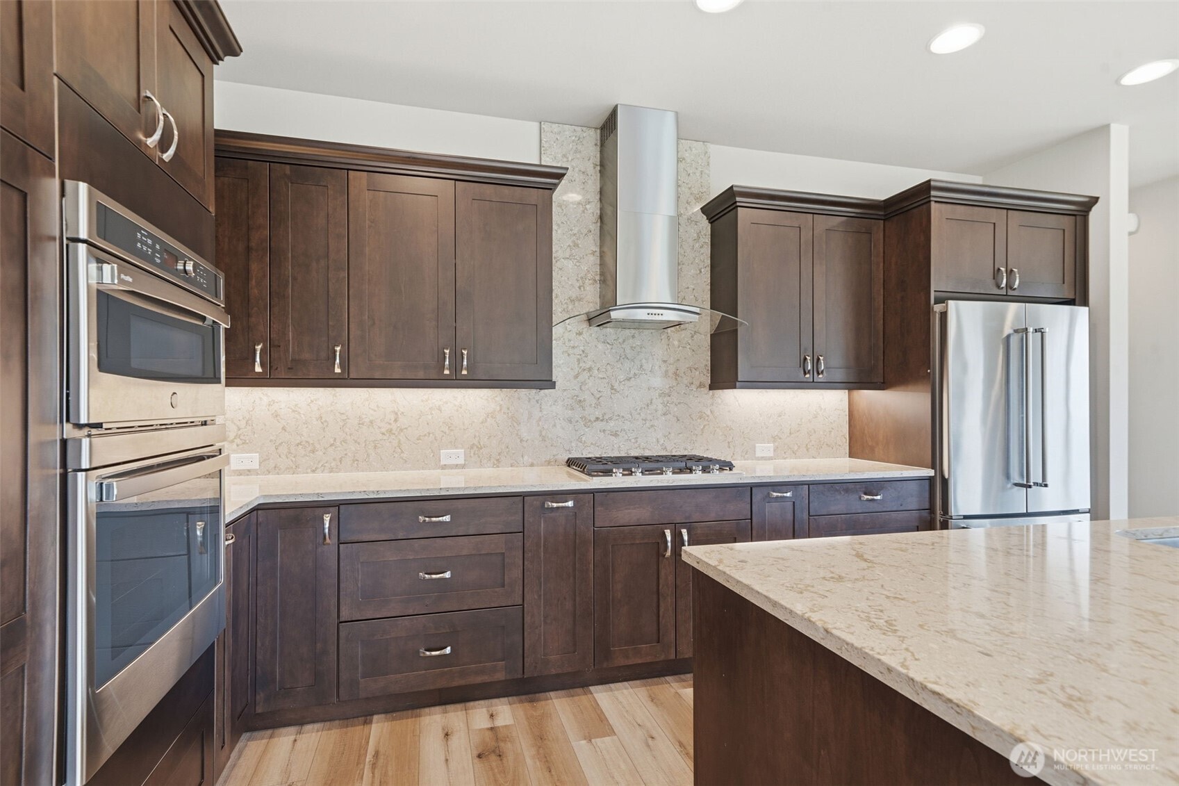 35 Viking Way Sequim, WA 98382 - Photo 15 of 39 a kitchen with stainless steel appliances granite countertop a refrigerator a stove and a sink with wooden cabinets