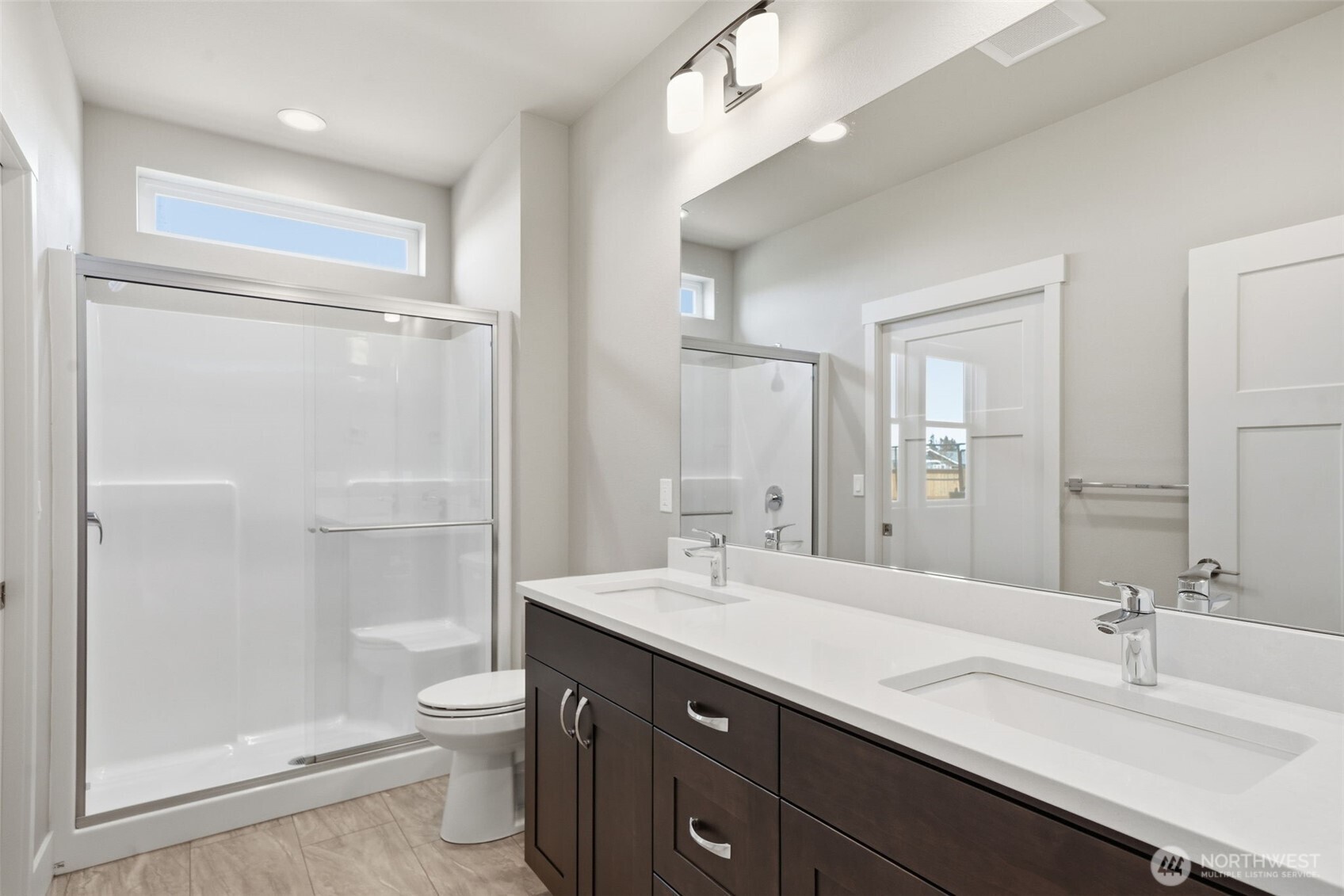35 Viking Way Sequim, WA 98382 - Photo 28 of 39 a bathroom with a double vanity sink toilet mirror and shower