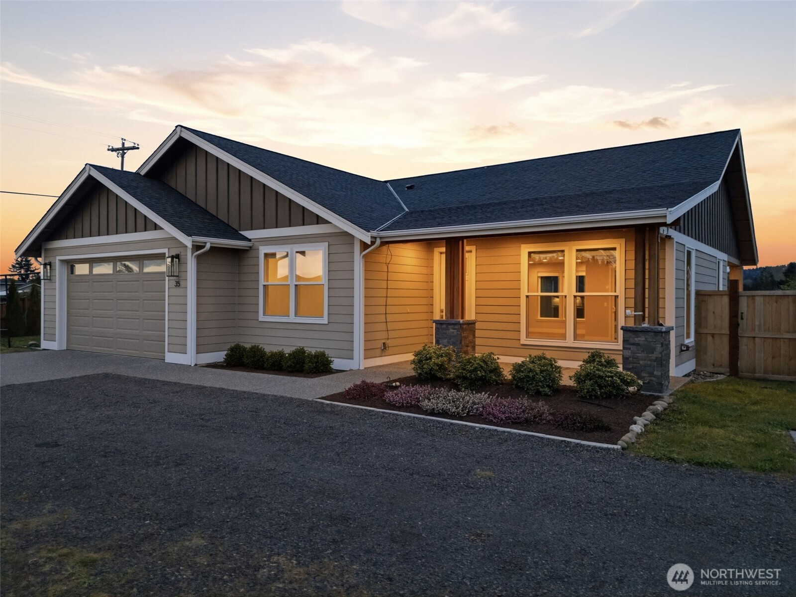 35 Viking Way Sequim, WA 98382 - Photo 3 of 39 a front view of a house with a garden