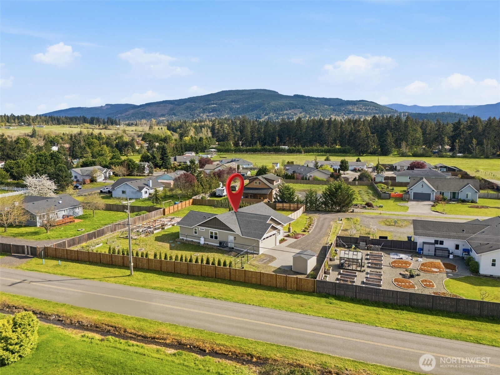 35 Viking Way Sequim, WA 98382 - Photo 36 of 39 a view of a swimming pool with mountains and a mountain view