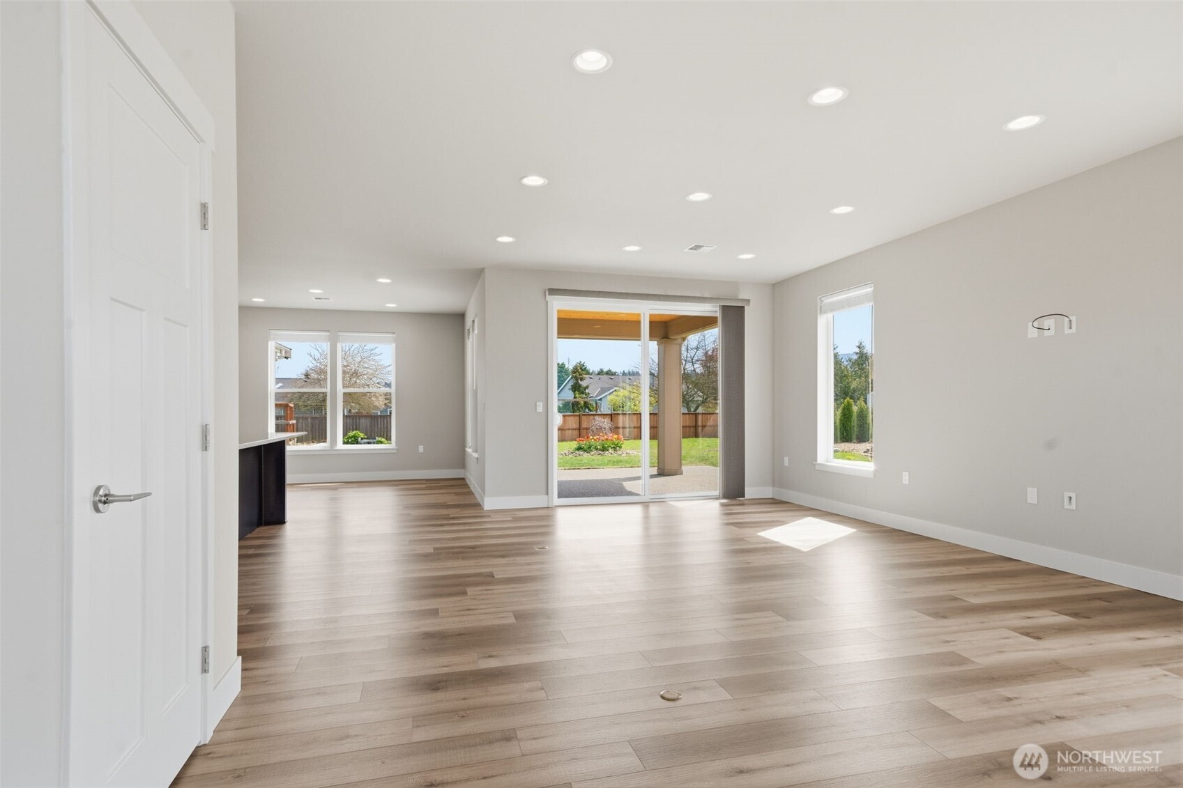 35 Viking Way Sequim, WA 98382 - Photo 5 of 39 an empty room with wooden floor and windows