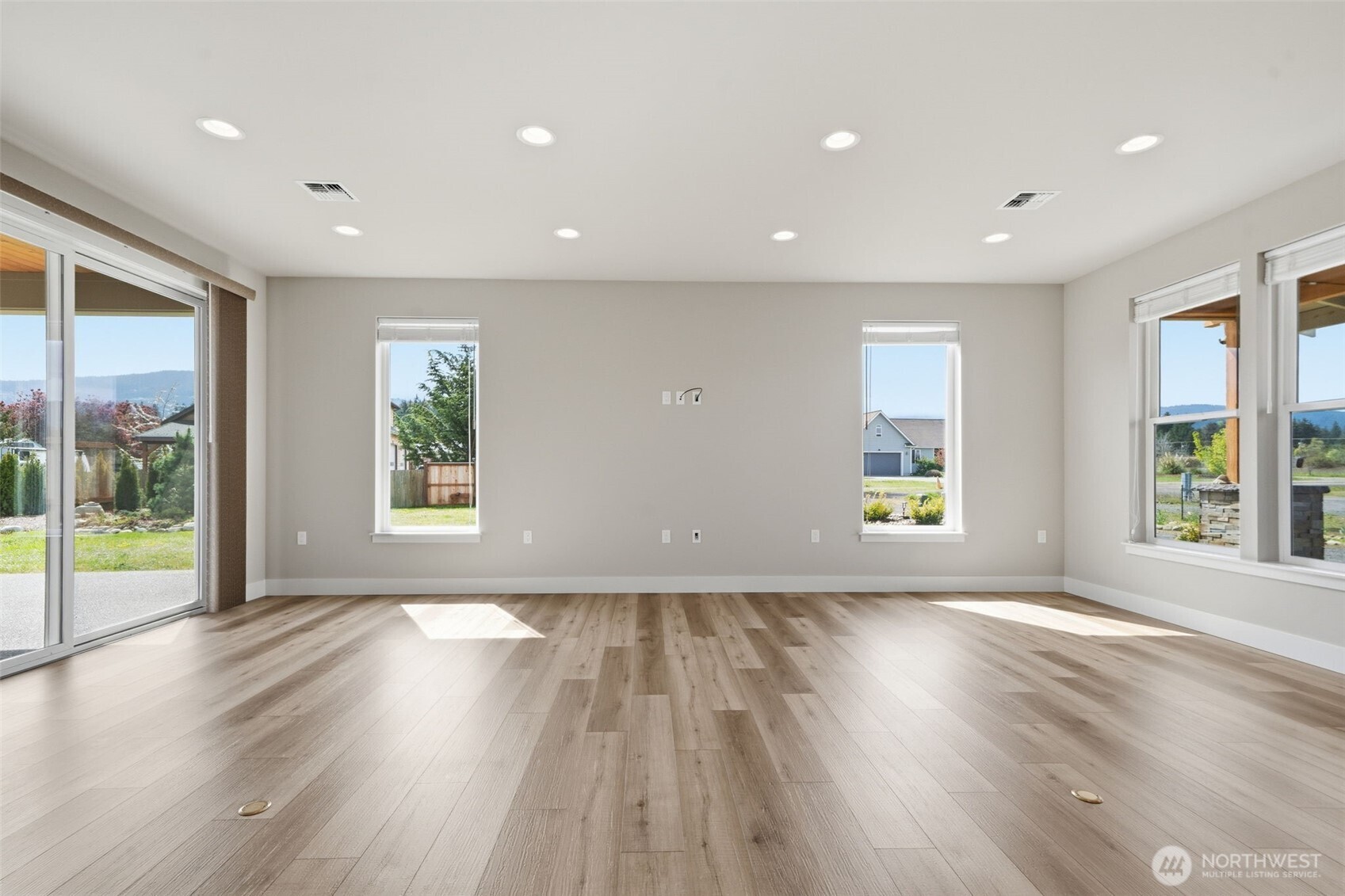 35 Viking Way Sequim, WA 98382 - Photo 6 of 39 a view of an empty room with wooden floor and a window