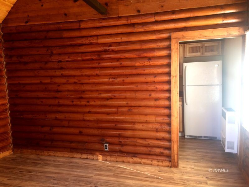52810 Pine Cove Road Idyllwild, CA 92549 - Photo 14 of 21 a view of empty room with wooden floor and cabinet
