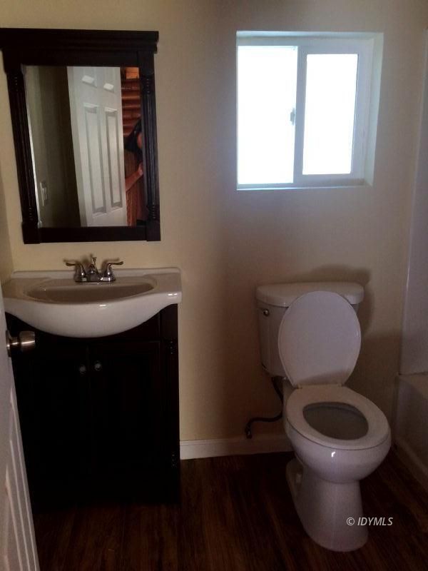 52810 Pine Cove Road Idyllwild, CA 92549 - Photo 15 of 21 a bathroom with a toilet sink and mirror