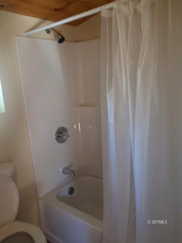 52810 Pine Cove Road Idyllwild, CA 92549 - Photo 16 of 21 a bathroom with a shower and a toilet