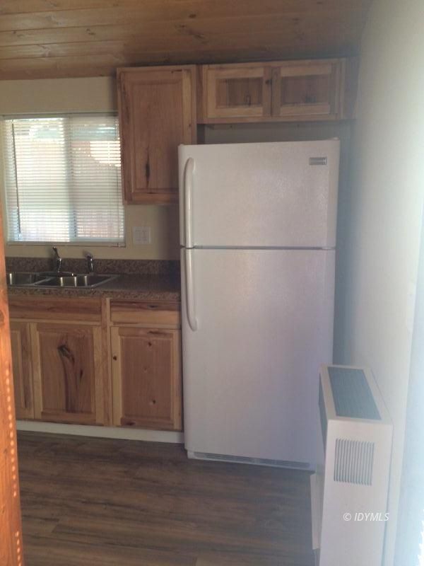 52810 Pine Cove Road Idyllwild, CA 92549 - Photo 18 of 21 a view of a kitchen with wooden floor