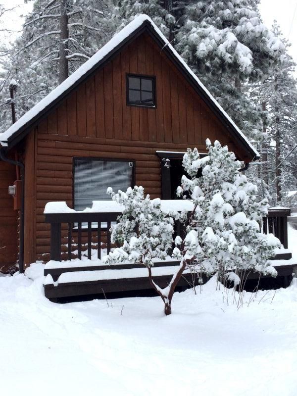 52810 Pine Cove Road Idyllwild, CA 92549 - Photo 19 of 21 a wooden bench sitting in front of a building