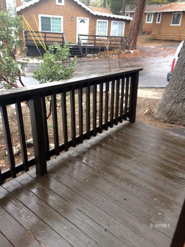 52810 Pine Cove Road Idyllwild, CA 92549 - Photo 20 of 21 a balcony with wooden floor outdoor seating