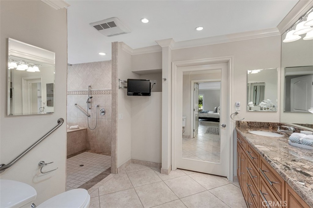 28102 Pinnacles Court Laguna Niguel, CA 92677 - Photo 15 of 30 a bathroom with a granite countertop sink mirror and toilet