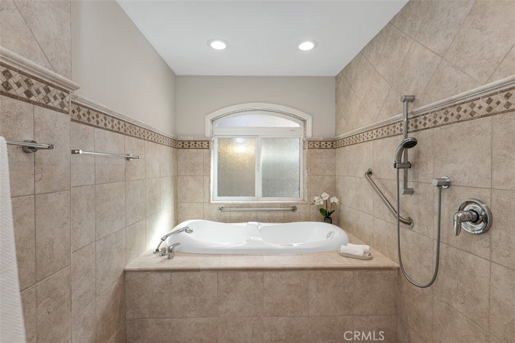 28102 Pinnacles Court Laguna Niguel, CA 92677 - Photo 16 of 30 a bathroom with a bathtub and shower
