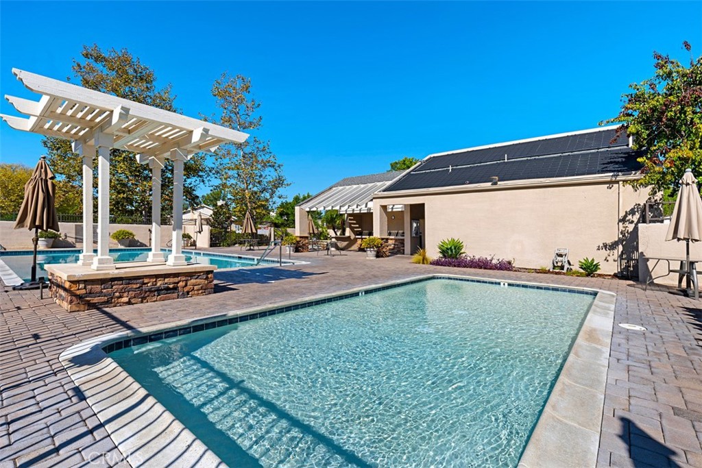 28102 Pinnacles Court Laguna Niguel, CA 92677 - Photo 29 of 30 a view of a patio with swimming pool table and chairs