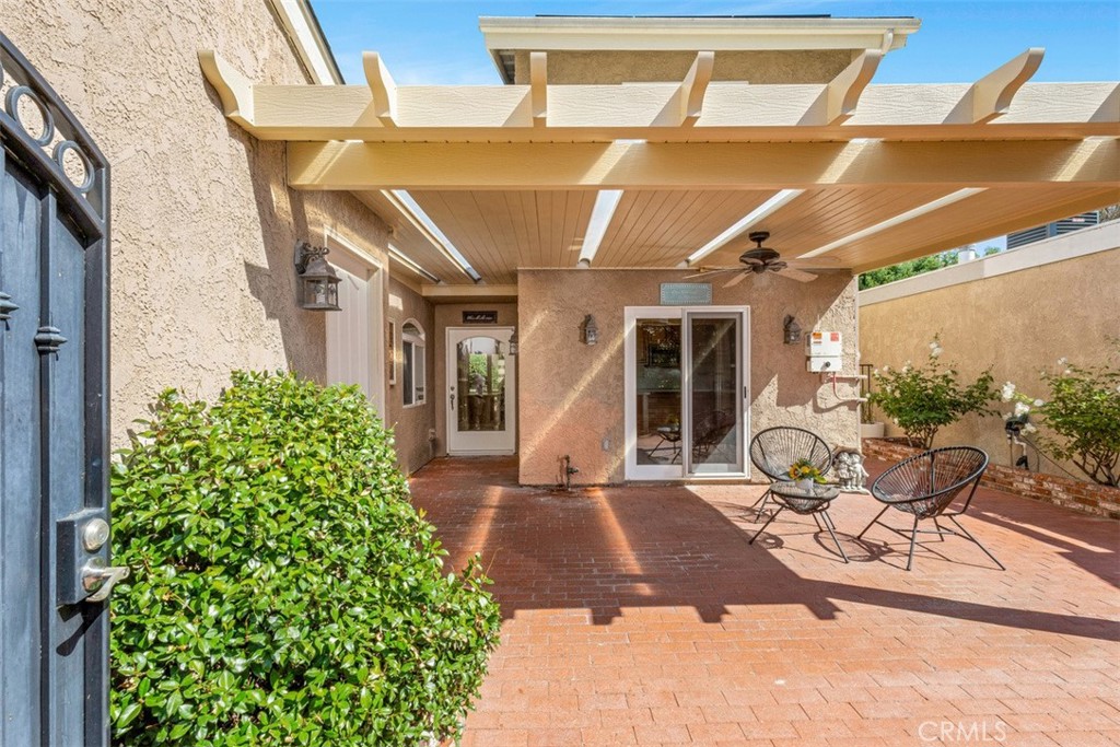 28102 Pinnacles Court Laguna Niguel, CA 92677 - Photo 4 of 30 a view of a patio with table and chairs and potted plants