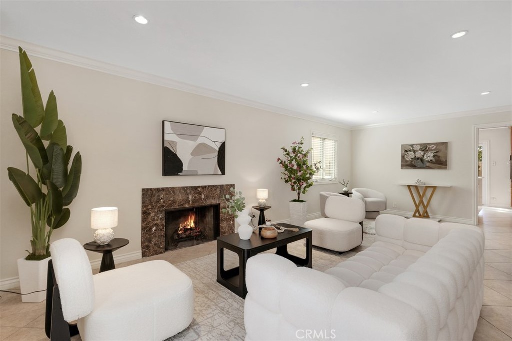 28102 Pinnacles Court Laguna Niguel, CA 92677 - Photo 9 of 30 a living room with furniture a fireplace and a flat screen tv