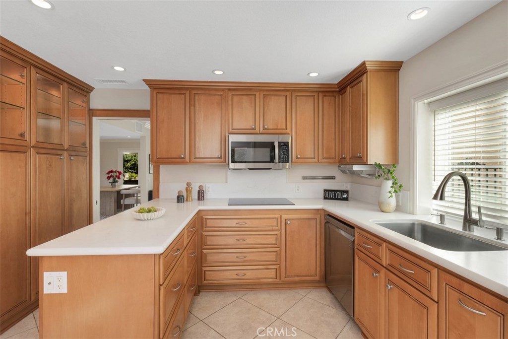 28102 Pinnacles Court Laguna Niguel, CA 92677 - Photo 10 of 30 a kitchen with a sink a stove and cabinets