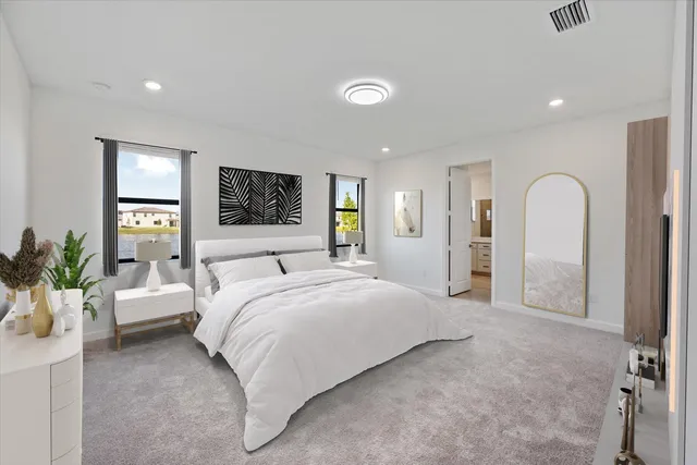 a spacious bedroom with bed and a large mirror