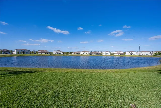 a view of yard with swimming pool and an outdoor space