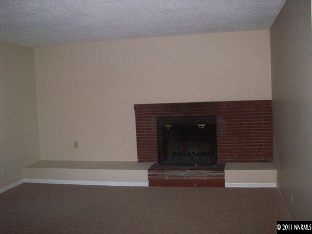 1415 Exeter Way Reno, NV 89503 - Photo 2 of 8 a room with a fireplace