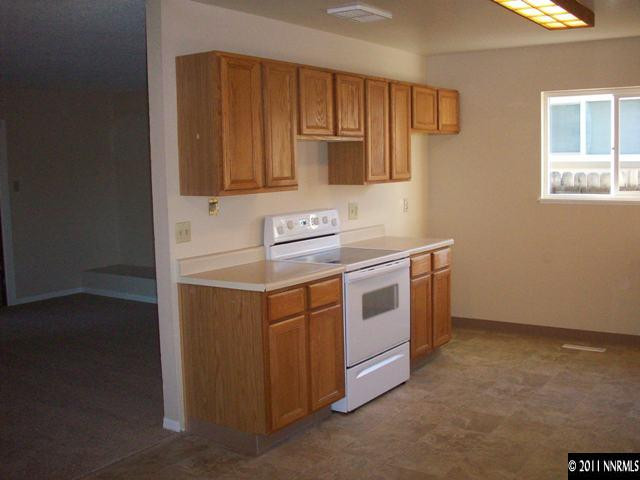 1415 Exeter Way Reno, NV 89503 - Photo 5 of 8 a utility room with stainless steel appliances wooden cabinets and a sink