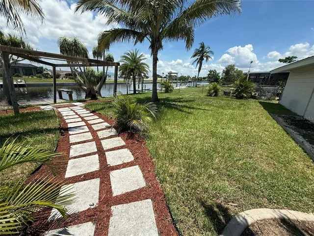 a view of backyard with outdoor seating