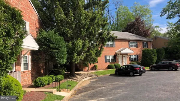 a view of a parked cars in front of house