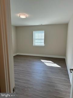 20 Haws Lane, Unit K42 Flourtown, PA 19031 - Photo 7 of 9 an empty room with wooden floor and windows