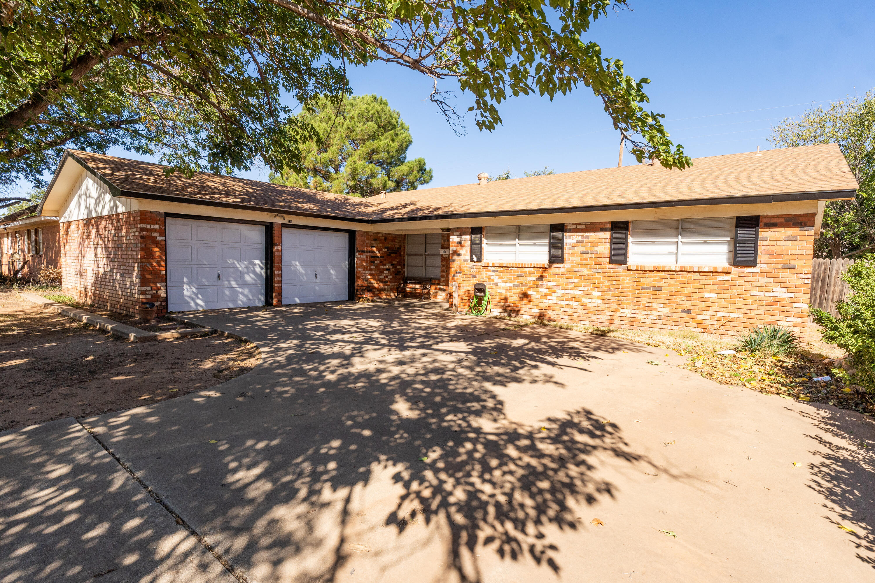 5314 46th Street Lubbock, TX 79414 - Photo 1 of 15 front view of a house with a yard