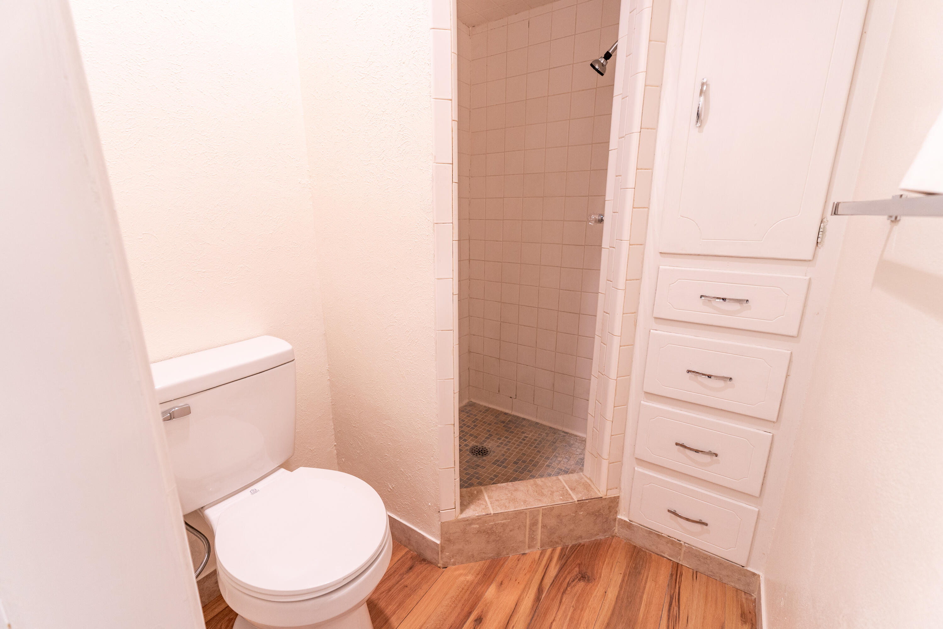 5314 46th Street Lubbock, TX 79414 - Photo 11 of 15 a bathroom with a toilet and a shower