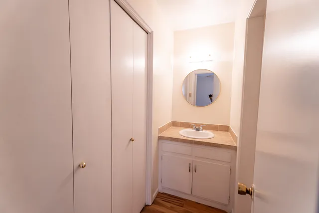 a bathroom with a sink and a mirror