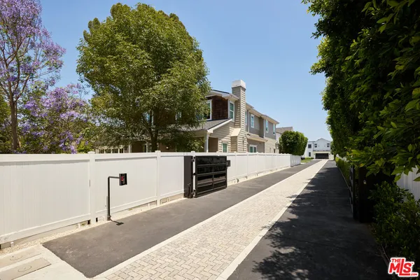 a view of a house with a street