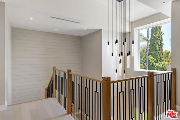 a view of a hallway with windows