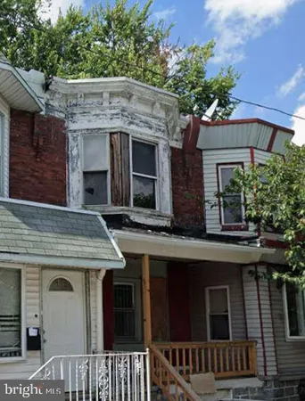 a view of a house with a tree