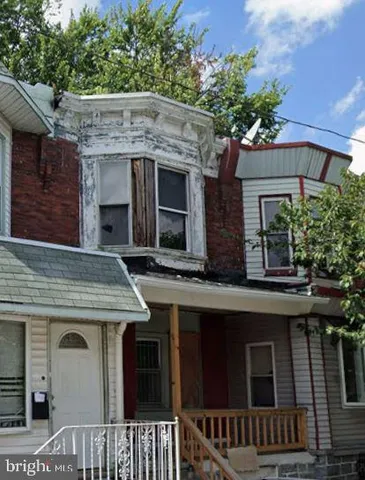 a view of a house with a tree
