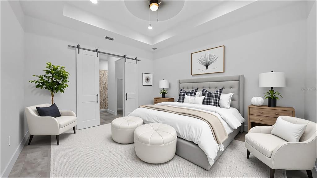 9 Tee View Road Rotonda West, FL 33947 - Photo 21 of 38 a bedroom with bed and a couch