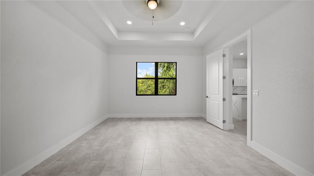 9 Tee View Road Rotonda West, FL 33947 - Photo 23 of 38 an empty room with windows and closet