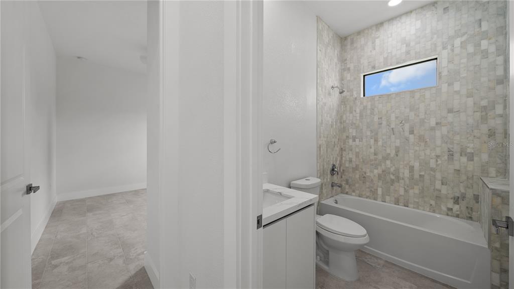 9 Tee View Road Rotonda West, FL 33947 - Photo 29 of 38 a bathroom with a toilet and a shower