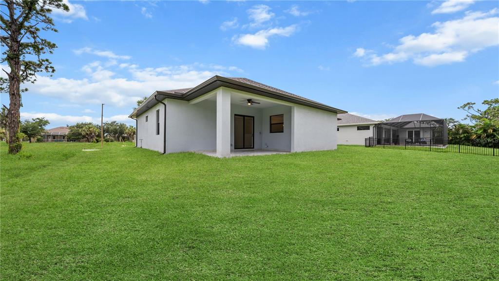 9 Tee View Road Rotonda West, FL 33947 - Photo 36 of 38 a house view with a garden space