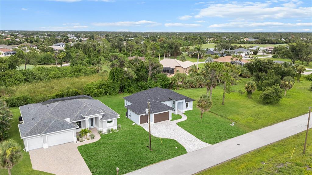 9 Tee View Road Rotonda West, FL 33947 - Photo 5 of 38 an aerial view of a house with a garden