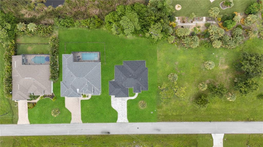 9 Tee View Road Rotonda West, FL 33947 - Photo 9 of 38 an aerial view of a house with a yard