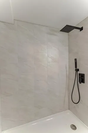 a bathroom with a bath tub and a shower