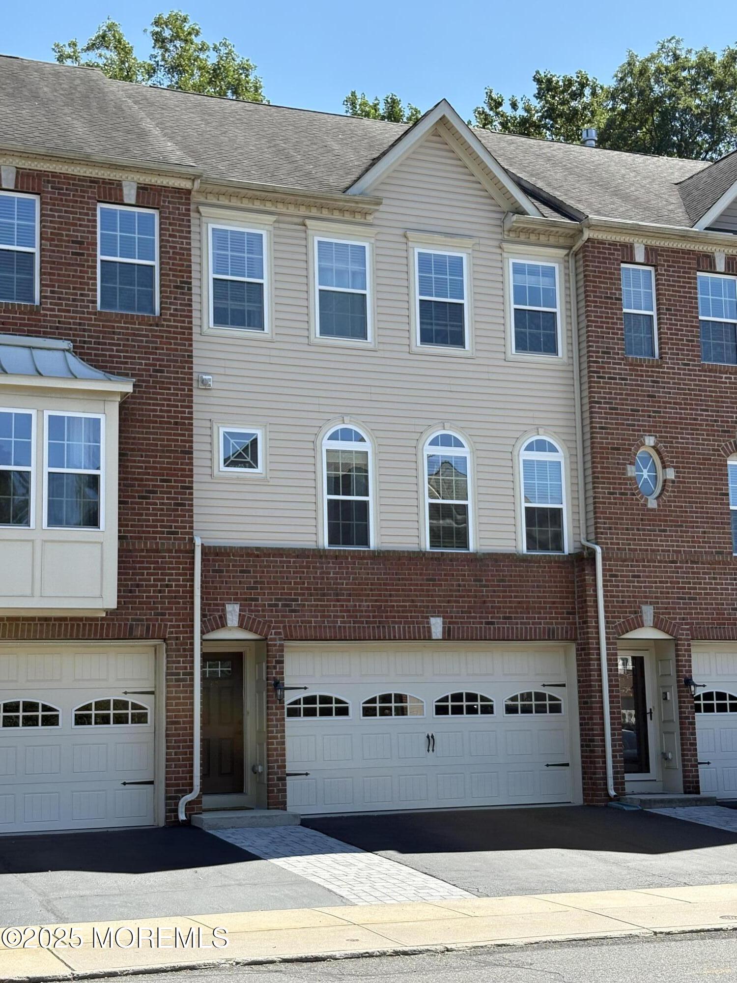 63 Pate Drive Middletown, NJ 07748 - Photo 1 of 50 a front view of a house with a yard